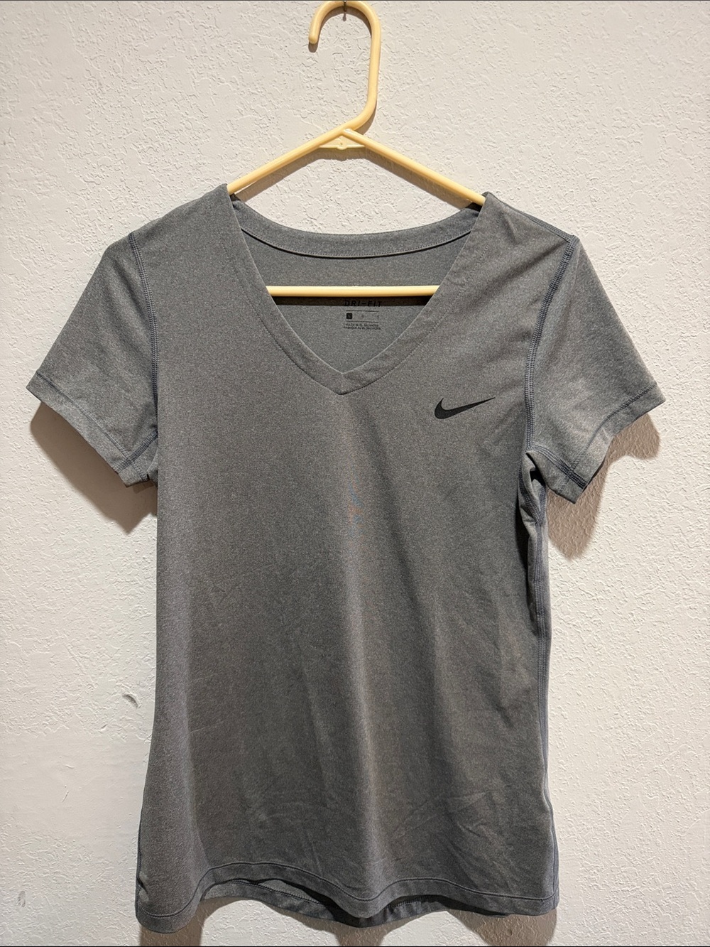 Nike Women’s Gray V-Neck Athletic Tee with Black Swoosh